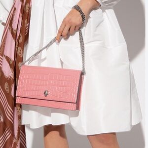 Alexander McQueen small skull crossbody and shoulder bag in coral